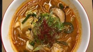 Spicy Veggie Miso · Veggie miso broth, thin wavy noodle, cabbage, bean sprouts, shitake mushroom, and jalapeno p...