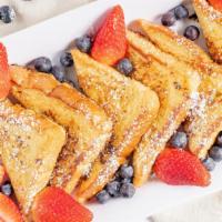 Old Fashion French Toast · Three slices of old fashion French toast. Served with powdered sugar. Butter and syrup on th...