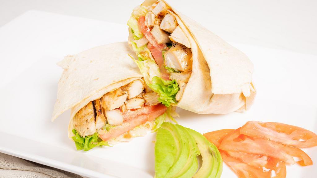Grilled Chicken Avocado Wrap · Grilled chicken, avocado, lettuce, tomato, and chipotle mayonnaise on a wrap.