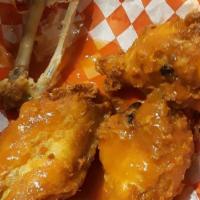 Chicken Wings · Buffalo or BBQ style. Comes with a side of blue cheese.