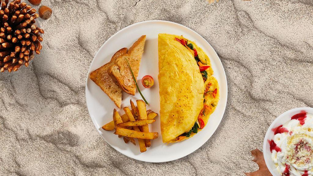 Vibrant Veggie Omelette · Eggs cooked with tomatoes, onions, mushrooms, peppers, and broccoli.  Served with toast and home fries.