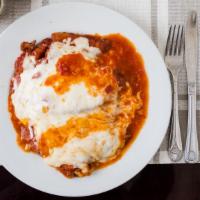 Chicken Parmigiana · Breast of chicken topped with tomato sauce and mozzarella. Served with pasta, salad or brocc...