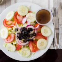 Tomato Salad · Tomato salad, virgin olive oil, red onions and garlic.