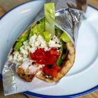 Somethingreek · Chicken souvlaki on a pita topped with roasted red peppers, romain lettuce, crumbled feta an...