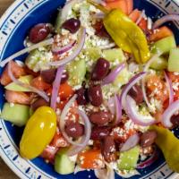 Tomato Salad · Tomato, red onion, cucumbers, feta, pepperoncini & kalamata olives.