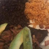 Carne Asada · Flat iron steak topped with onions and mushrooms served with rice, black beans, avocado and ...