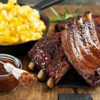 Half Rack · St. Louis style pork ribs are pit-smoked for 4 hours over a smoldering hickory fire. Then sl...