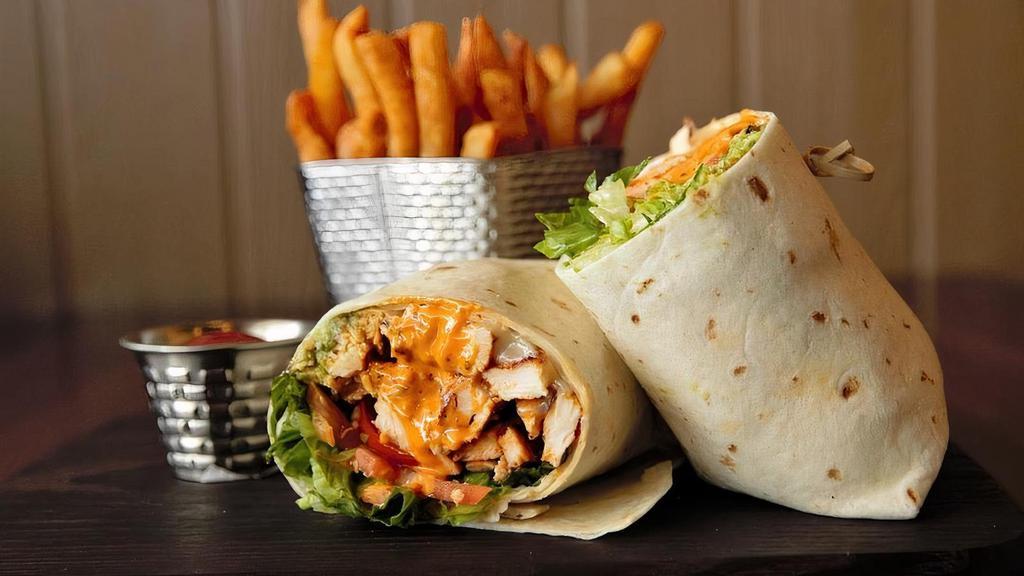 Chicken Avocado Wrap · Grilled chicken, Romaine, tomatoes, Provolone, chipotle mayo, and avocado. Choice of white or wheat wrap