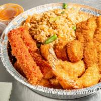 Seafood Deluxe · 1 piece of whiting fish, 2 pieces of crab sticks, and 3 pieces of shrimp, and 5 scallops ser...