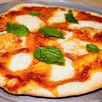 Margherita Pizza · Tomato sauce, fresh garlic, oregano, fresh basil, mozzarella, parmesan, olive oil