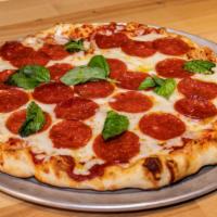 Pepperoni Pizza · Tomato sauce, fresh garlic, basil, oregano, pepperoni, mozzarella cheese, parmesan cheese, o...