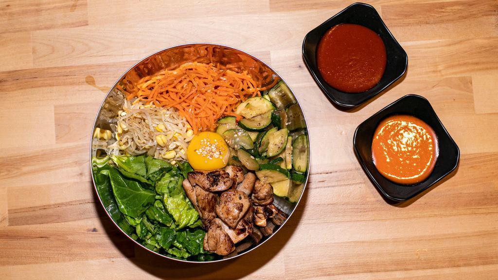 Bibimbap · served with seasoned rice, fresh greens, seasonal vegetables. Choice of white or brown rice. Choice of gochujang chili paste or special soy sauce