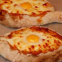 Oven Baked Pie “Khachapuri Adjarian “ · Formed in to open boat shape, stuffed with extra rich mix of Georgian cheese, an organic egg...