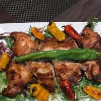 Chicken Tabaka · Grilled, succulent chicken aromatic sauce “adjika”.