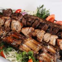 Chicken Kebab · 5 pieces , marinated chicken served with Grilled vegetables , potato and Georgian
souse “Adj...
