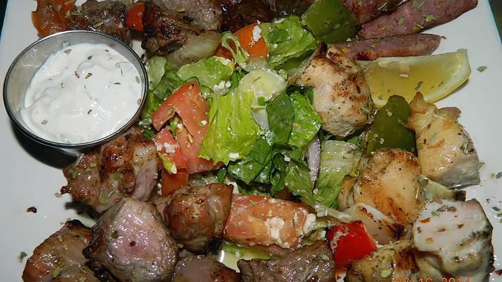 Athenian Meat Platter · Includes chicken kebob, gyro, pork kebob and lukaniko. Served with Greek salad and tzatziki sauce.