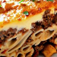 Pastichio (Regular Or Vegetarian) · Greek pasta noddles with seasoned ground beef and baked with béchamel. Served with Greek sal...