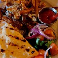 Greek Style Burger · Made with chopped meat, onion, egg and bread crumbs served on a pita. Includes Greek fries a...