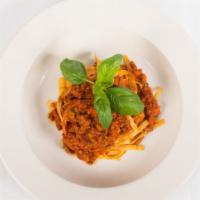 Fettuccine Bolognese · Tossed in a Traditional Tomato Meat Sauce.