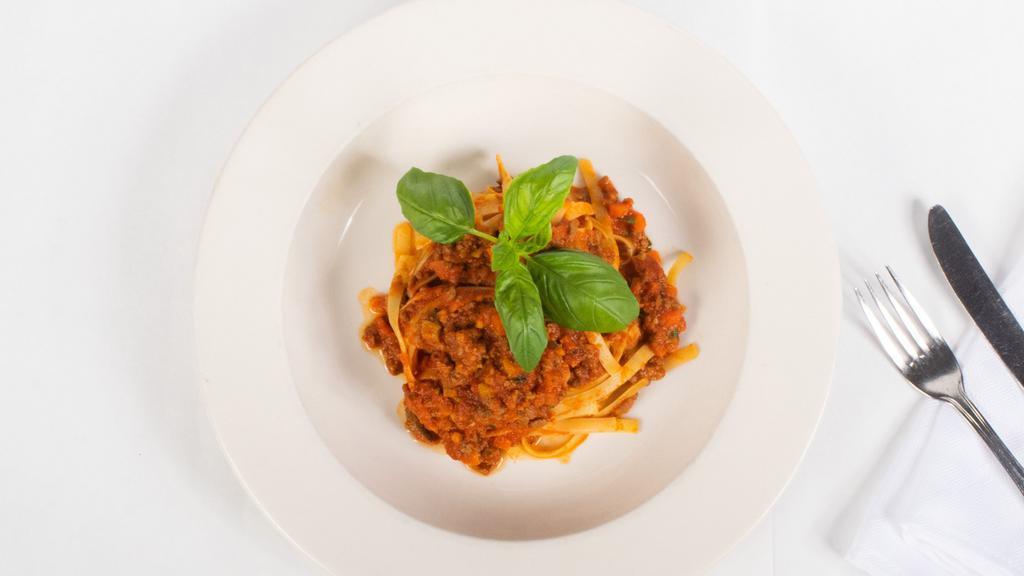 Fettuccine Bolognese · Tossed in a Traditional Tomato Meat Sauce.