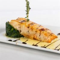 Salmone In Crosta · Alaskan Salmon Wrapped in Potato Crust on a Bed of
Spinach
with a Light Mustard Sauce.