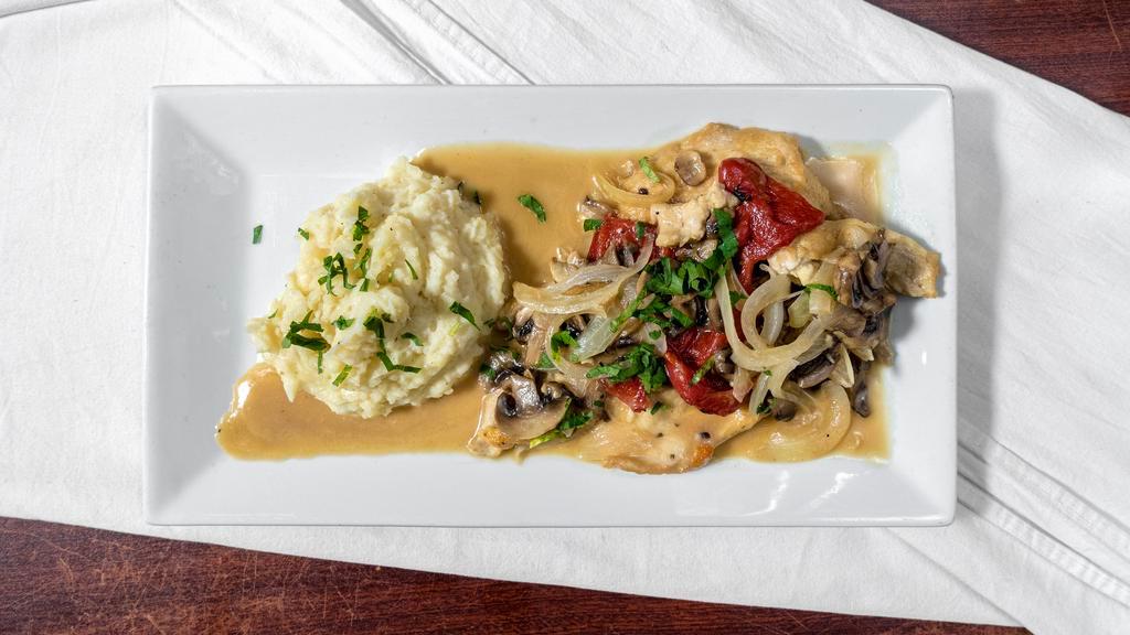 Lonza Di Maiale · Boneless Loin of Pork Sautéed in Port Wine
with Caramelized Onions and Pears. Served over Garlic Mashed Potatoes.