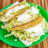  ( Corn  Shell) Chicken · Soft Corn shell tortilla is filled with lettuce, queso fresco and sour cream . Flour tortill...