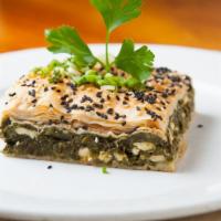1/2 Spinach Pie Triangles Tray · Greek homemade pie filled with spinach and feta cheese.