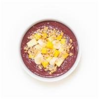 Tropical Acai Bowl · Refreshing acai blend topped with granola, banana, pineapple, mango, shredded coconut, and h...