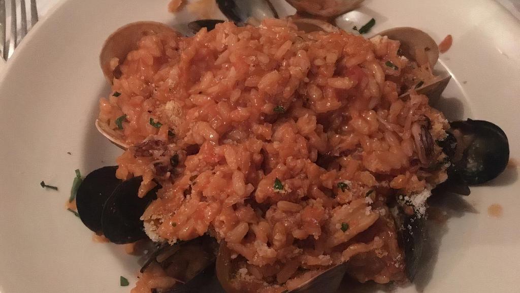 Risotto Alla Pescatora (Seafood) · Arborio rice with mixed seafood (shrimp, mussels, clams and calamari) in red sauce.
