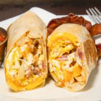 Breakfast Burrito · Scrambled eggs, onion, potatoes, ham, cheddar-jack, cotija, salsa