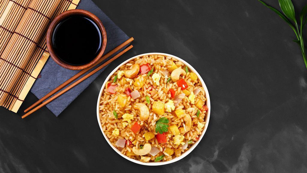 Pineapple Fried Rice · Stir-fried rice with pineapple, cashew nut, tomato, and onion with vegan Thai seasoning.