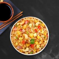 Pen Pineapple Fried Rice · Pineapple fried rice with celery, mixed vegetables, onions, your choice of protein and sauce.