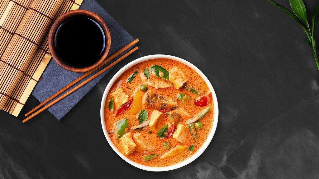 Red Curry · Red curry sauce, coconut milk, bamboo shoot, basil, and bell pepper (Very spicy).