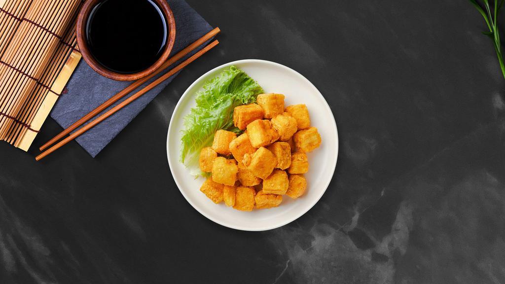 Golden Tofu · Fried tofu, served with vegan sweet chili sauce and crushed peanut.