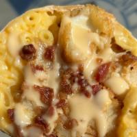 The Legend Burrito · Chicken fingers, mozzarella sticks, bacon, queso, mac & cheese, and french fries