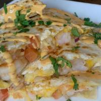 Shrimpy Quesadilla · Grilled shrimp, melted cheese, shrimpy sauce, and pico de gallo, cooked in a flour tortilla....