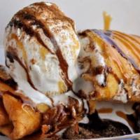 Reesarito · Deep fried burrito stuffed with marshmallows and reeses, topped with caramel and chocolate d...