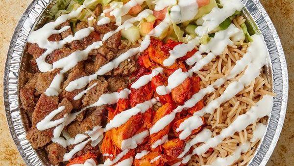 Mix Over Rice · Platters with rice. Toppings to choose from, lettuce, cucumbers, tomatoes, onions, green peppers, black olives, chickpeas, banana peppers, hot sauce, and white sauce.