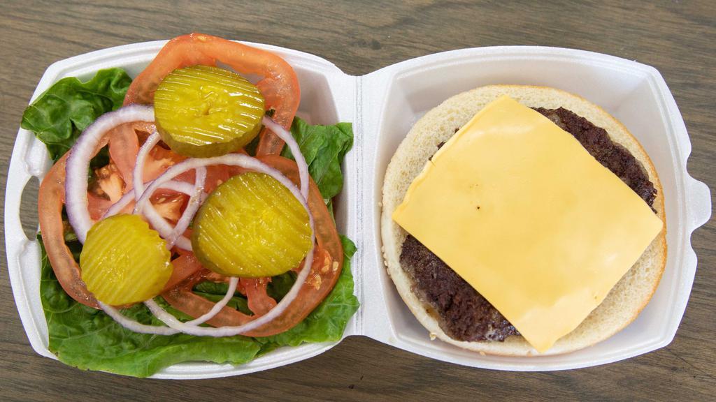 Classic Burger · Beef patty, American cheese, lettuce, tomatoes. Onions pickles and tomatoes and mustard.