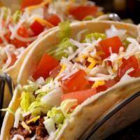 Tacos · Crunchy and soft Chicken or Lamb with lettuce, pico de gallo, cheddar cheese, and sour cream.