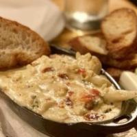 Roasted Cauliflower And Aged White Cheddar Dip · Suitable for vegetarians. With grilled bread and veggie sticks.