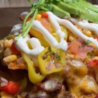 Rogues Chipotle Ale Chili Nachos · House-made corn tortilla chips, beef chili chopped tomatoes, melted cheese, charred corn sal...
