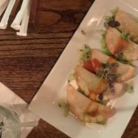 Fried Buffalo Veggie Dumplings · Vegan. With celery slaw.