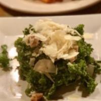 Organic Kale Caesar Salad · With white anchovies, garlicky Caesar dressing, herbed croutons, and shaved parmesan cheese....