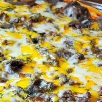 Philly Cheese Steak Pizza · Fresh steak, Green peppers, American cheese, Mozzarella Cheese & Onions