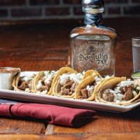 Tacos De Carnitas · Marinated pork, slowly braised, traditional Mexican recipe from Michoacan. Three tacos per o...