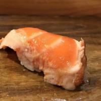 Seared Salmon Sushi · Seared and marinated salmon belly.