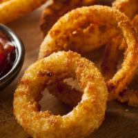 Crispy Onion Rings · Our thick-cut onion rings are made from whole white onions, battered with a subtle blend of ...