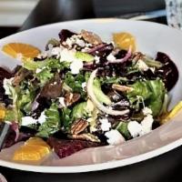 Beet Salad · Served with orange wedges, goat cheese, candied pecans & pineapple vinagrette.